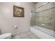 Bathroom with tub, toilet and shower at 1301 Tuscan Ter # 9403, Davenport, FL 33896