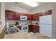Modern kitchen with double sink and granite counters at 1301 Tuscan Ter # 9403, Davenport, FL 33896