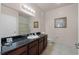 Bathroom with dark vanity, shower, and toilet at 1301 Tuscan Ter # 9403, Davenport, FL 33896