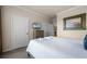 Bedroom with a queen bed, dresser, and a closet at 1301 Tuscan Ter # 9403, Davenport, FL 33896