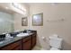 Bathroom with dark vanity, shower, and toilet at 1301 Tuscan Ter # 9403, Davenport, FL 33896
