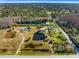 Aerial view of property showing home, pond, and surrounding land at 5303 Holopaw Rd, Saint Cloud, FL 34773