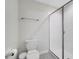 Clean bathroom with toilet, shower, and tile floor at 8839 Interlocking Ct, Davenport, FL 33896