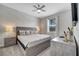 King bed, ceiling fan, and tranquil wallpaper at 8839 Interlocking Ct, Davenport, FL 33896