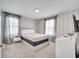 Bedroom with queen bed and chevron patterned wall at 8839 Interlocking Ct, Davenport, FL 33896
