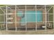 Overhead view of private pool, spa, and screened enclosure at 8839 Interlocking Ct, Davenport, FL 33896