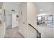 Upper level hallway with access to laundry and bedrooms at 8839 Interlocking Ct, Davenport, FL 33896