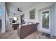 Covered patio with seating area and access to the pool at 8839 Interlocking Ct, Davenport, FL 33896