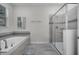 Bathroom with soaking tub and walk-in shower at 8839 Interlocking Ct, Davenport, FL 33896