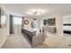 Open living area with sectional sofa and wall-mounted TV at 8839 Interlocking Ct, Davenport, FL 33896