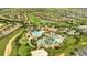 Resort-style community pool and clubhouse with surrounding homes and golf course at 8839 Interlocking Ct, Davenport, FL 33896