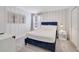 Cozy bedroom with a navy blue bed frame and striped walls at 8839 Interlocking Ct, Davenport, FL 33896