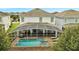 Private pool and spa with screened enclosure and patio furniture at 8839 Interlocking Ct, Davenport, FL 33896