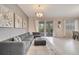 Comfortable living room featuring a sectional sofa and pool view at 8839 Interlocking Ct, Davenport, FL 33896