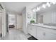 Elegant bathroom with double vanity and a large mirror at 8839 Interlocking Ct, Davenport, FL 33896