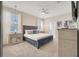 Spacious main bedroom with plush carpeting and ensuite bathroom at 8839 Interlocking Ct, Davenport, FL 33896