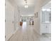 View down a long hallway that shows access to the kitchen and bathroom at 8839 Interlocking Ct, Davenport, FL 33896