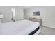 King size bed, dresser, and TV at 8839 Interlocking Ct, Davenport, FL 33896
