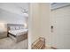 Guest bedroom entry with shoe rack and view of the bedroom at 8839 Interlocking Ct, Davenport, FL 33896