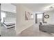 Common area with comfortable couch and access to bedroom at 8839 Interlocking Ct, Davenport, FL 33896