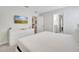 Spacious bedroom with TV, dresser, and ensuite bathroom at 8839 Interlocking Ct, Davenport, FL 33896