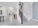 Modern staircase with metal railing and grey carpeting at 8839 Interlocking Ct, Davenport, FL 33896