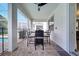 Covered patio with outdoor dining area and access to the pool at 8839 Interlocking Ct, Davenport, FL 33896