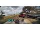 Lakefront deck with seating and a boat in view at 83 Douglas Way, Frostproof, FL 33843