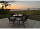 Peaceful deck overlooking a serene lake at sunset at 83 Douglas Way, Frostproof, FL 33843