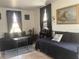 Relaxing living room featuring a daybed and charming nautical accents at 83 Douglas Way, Frostproof, FL 33843