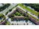 Aerial view of townhouses community with parking and tennis courts at 5150 Picadilly Circus Ct # 7, Orlando, FL 32839