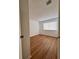 Simple bedroom with wood-look floors and neutral walls at 5150 Picadilly Circus Ct # 7, Orlando, FL 32839