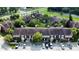 Complex of townhouses with brown roofs and parking area at 5150 Picadilly Circus Ct # 7, Orlando, FL 32839