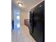 Kitchen with black refrigerator and dark wood cabinets at 5150 Picadilly Circus Ct # 7, Orlando, FL 32839