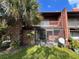 Spacious screened-in patio with brick flooring and access to the backyard at 5150 Picadilly Circus Ct # 7, Orlando, FL 32839