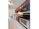 Kitchen with stainless steel appliances and dark wood cabinets at 5150 Picadilly Circus Ct # 7, Orlando, FL 32839
