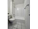 Bathroom with tub, toilet, and tiled floor at 5150 Picadilly Circus Ct # 7, Orlando, FL 32839