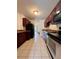 View of kitchen with stainless steel appliances and dark wood cabinets at 5150 Picadilly Circus Ct # 7, Orlando, FL 32839
