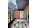 Bright screened patio with tile floor and brick walls at 5150 Picadilly Circus Ct # 7, Orlando, FL 32839