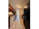 Full view of kitchen with dark wood cabinets and appliances at 5150 Picadilly Circus Ct # 7, Orlando, FL 32839
