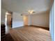 Large living area with laminate flooring and access to kitchen and hallway at 5150 Picadilly Circus Ct # 7, Orlando, FL 32839