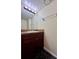 Dark wood bathroom vanity with a granite countertop at 5150 Picadilly Circus Ct # 7, Orlando, FL 32839