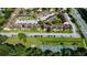 Aerial view of townhouses, parking, and a tennis court at 5150 Picadilly Circus Ct # 7, Orlando, FL 32839