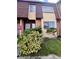 Front view of brick townhouse with landscaping at 5150 Picadilly Circus Ct # 7, Orlando, FL 32839