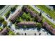 Aerial view showcasing townhouses, a central courtyard, and parking areas at 5150 Picadilly Circus Ct # 7, Orlando, FL 32839