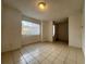Bright living room with tile flooring and sliding glass doors leading to a patio at 5150 Picadilly Circus Ct # 7, Orlando, FL 32839