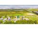 Aerial view of a house nestled amongst other homes, near a lake at 1380 E Lake Shore Blvd, Kissimmee, FL 34744