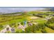 Aerial view showcasing a single-Gathering home with a large lake nearby at 1380 E Lake Shore Blvd, Kissimmee, FL 34744