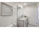Modern bathroom with a sleek vanity and large mirror at 1842 Tropical Palms Cir, Kissimmee, FL 34747