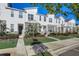 Modern townhouses with stone accents and neatly landscaped yards at 1842 Tropical Palms Cir, Kissimmee, FL 34747